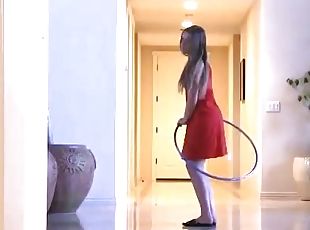 Solo sex model Aurielee plays with a hoop in the living room