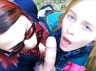 Two girls sucking dick outdoor and share cum facial