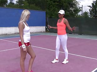 Adorable lesbian babes do it erotically at the playing court outdoors