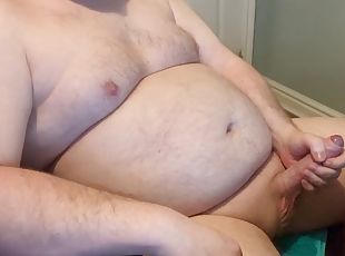 Chubby daddy jerks off a hard cock
