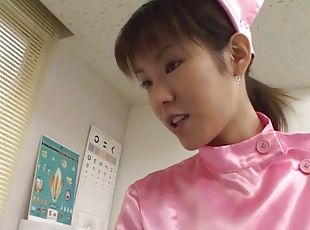 Sexy Asian nurse in pink stimulates her patient with her mouth