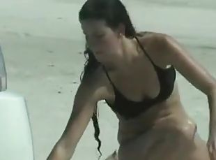 Sexy amateur chicks wearing bikinis get caught on a cam at a beach
