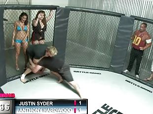 A sporty babe gets fucked hard in the middle of a cage fighting cage