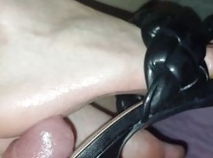 Inserting cock between her shoe and sole and cumming inside