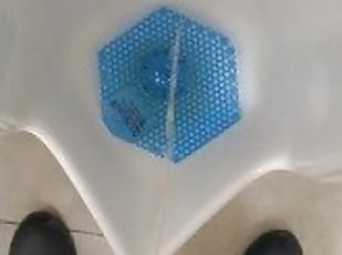 Pissing in a public urinal at work