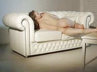 Gorgeous Teen Model Touches Her Body on a White Sofa