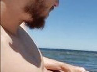 Brainwashed gooner boy strokes his cock on public beach