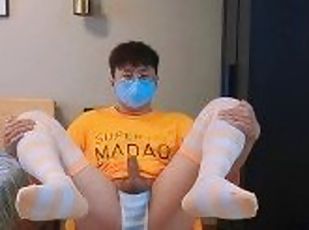 Boy in yellow t-shirt and stockings masturbates and cums at home