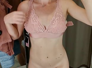 The girl tries on beautiful lingerie