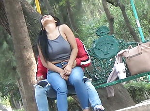 Latina beauty with boyfriend having fun in the park
