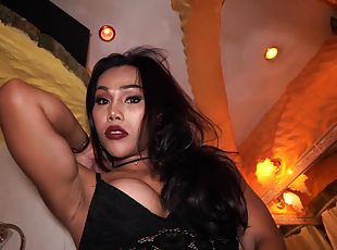 Gorgeous Thai transsexual Far looks so hot in her black set of lingerie.