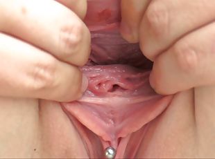 Look deep inside the pink pussy of the girl as she spreads