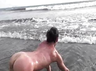 Hot brunette sex bomb does naked yoga on a gorgeous beach