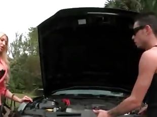 Mechanic works the car and those big bimbo tits