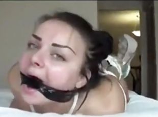 My deepthroat slut is hogtied on my bed and shows me her deepthroat skills.