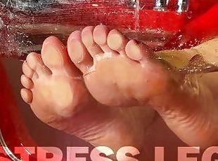 Mistress's wet wrinkled soles are pressed against the glass in the bathtub