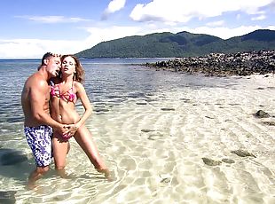Beautiful girl Lauryn May takes care of a dick on the beach