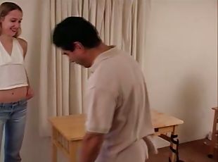 Liv the pretty blonde spanks a dude with a wooden stick