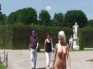 Naked girl walks through the gardens