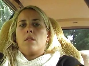 Blonde masturbating in the car in the parking lot