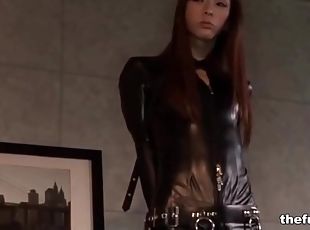 Bound Asian babe in black leather catsuit