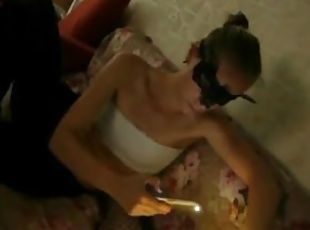 A young sexy amateur in a mask films a model on her phone